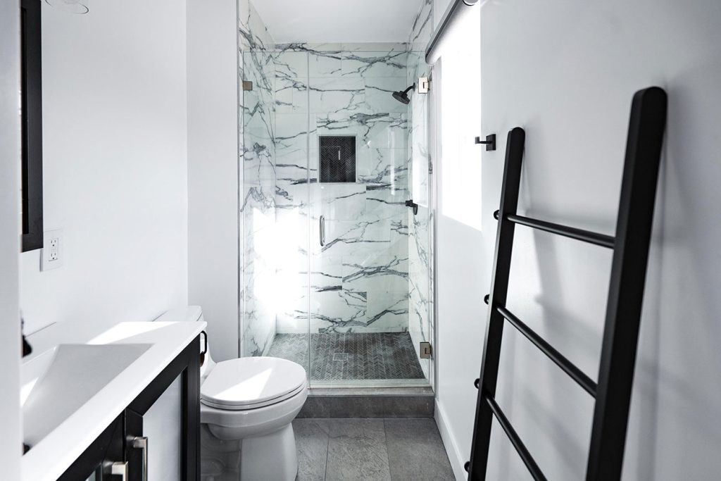 - Oasis Builders, Inc. Garage to ADU Complete Bathroom