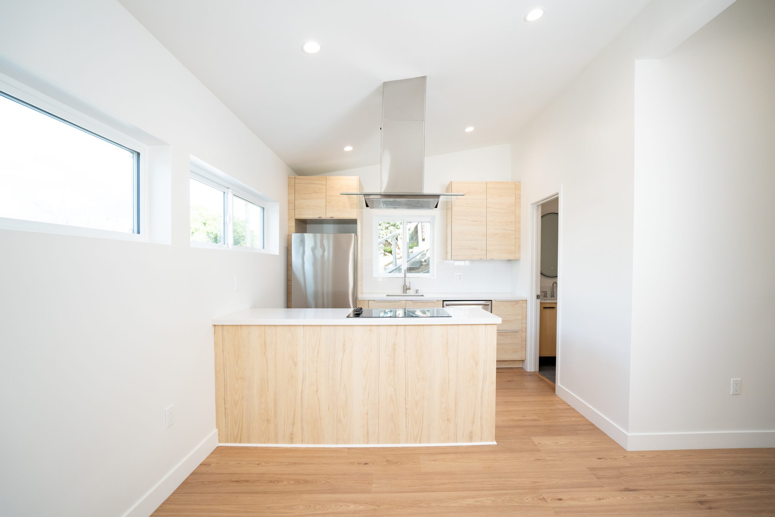 - Oasis Builders, Inc. ADU Kitchen featuring NEDDRAGEN glass cooktop