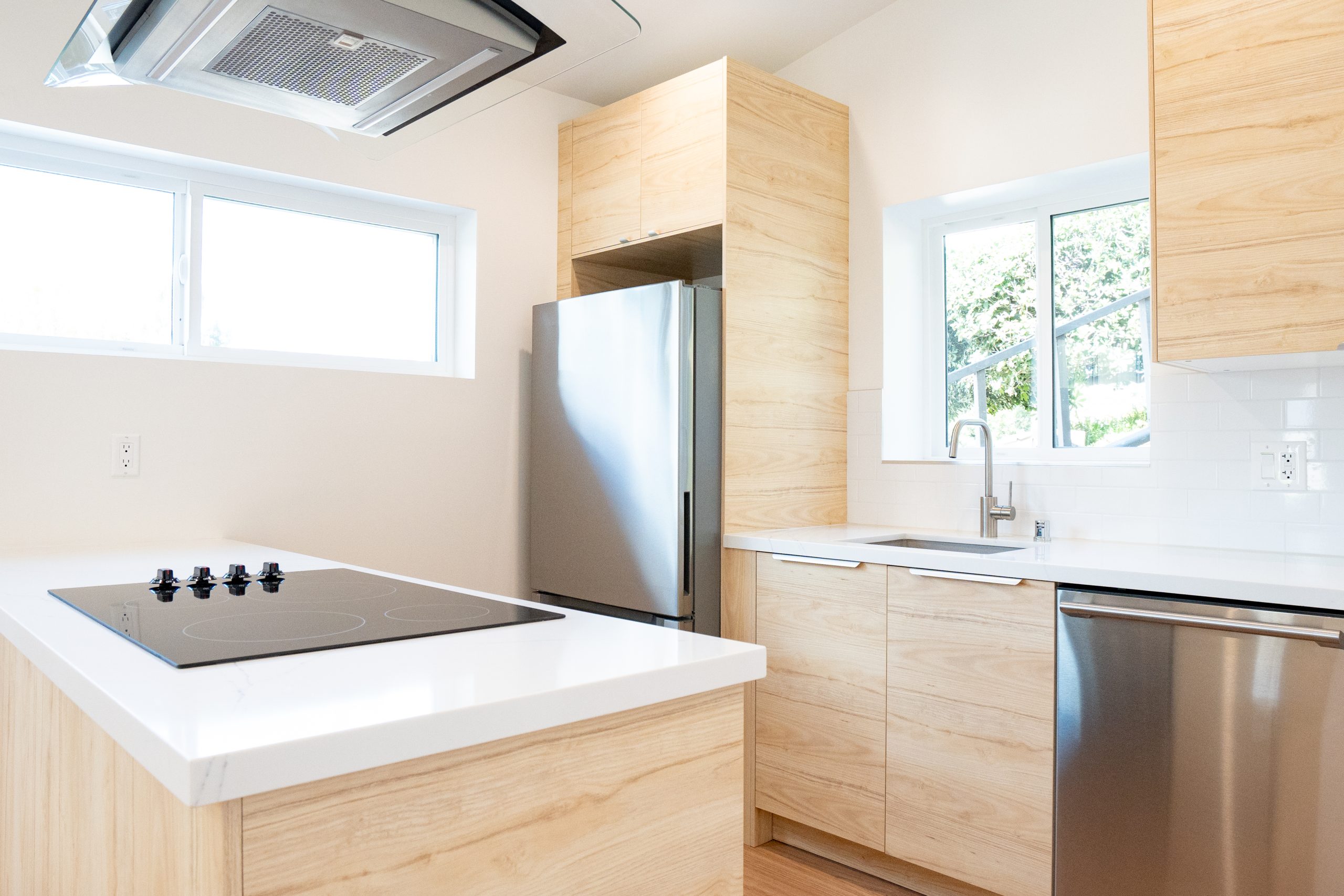 - Oasis Builders, Inc. VÄLGRUNDAD bottom freezer refrigerator and ESSENTIELL built in dishwasher