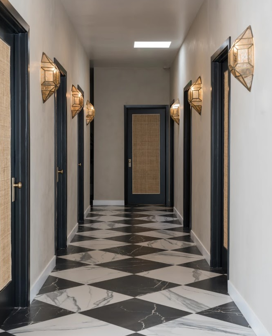 - Oasis Builders, Inc. Luxury hallway with black and white marble design