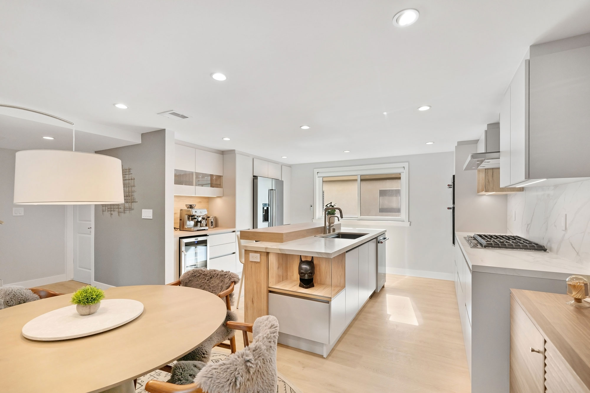 - Oasis Builders, Inc. Open Concept Kitchen Design with Waterfall Island