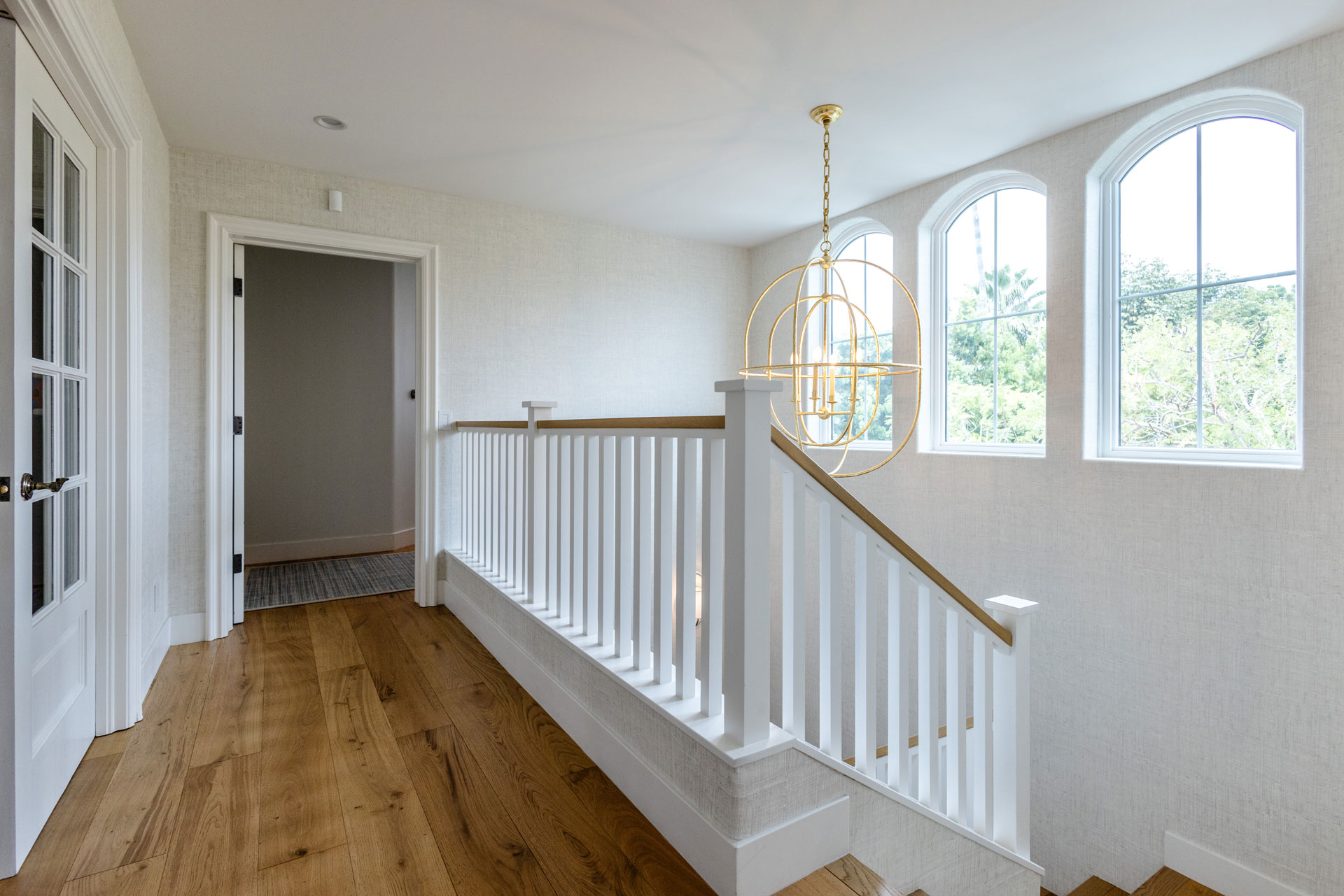 - Oasis Builders, Inc. Staircase design with white millwork